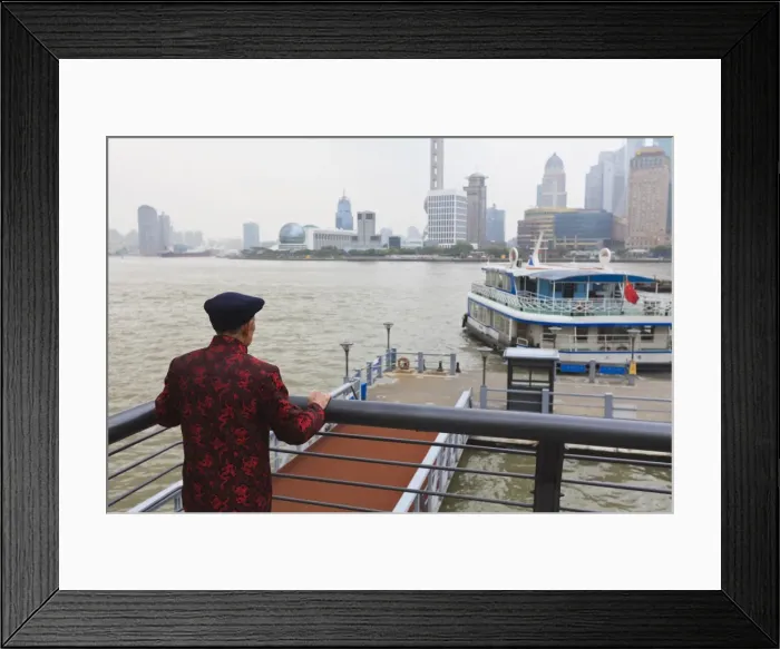 Framed Print : A man watching ferries crossing the Huangpu River, Shanghai, China, Asia Framed Print : A man watching ferries crossing the Huangpu River, Shanghai, China, Asia