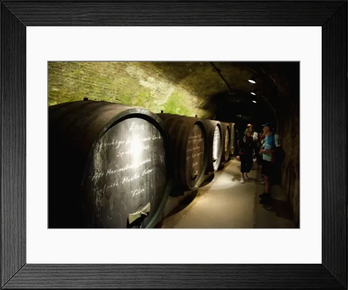 Framed Print : People and wine barrels inside cellar of Loisium Winery, Langelois, Niederosterreich Framed Print : People and wine barrels inside cellar of Loisium Winery, Langelois, Niederosterreich