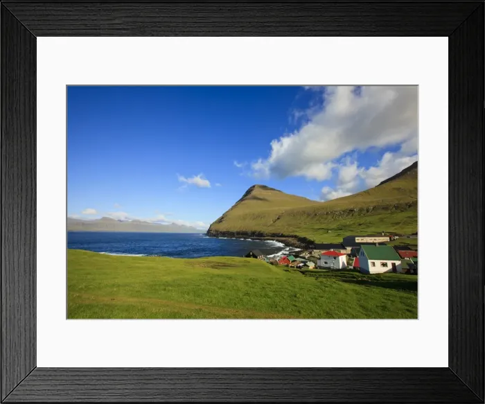 Framed Print : The picturesque village of Gjogv, with Middagsfjall Mountain and the Djupini in the background Framed Print : The picturesque village of Gjogv, with Middagsfjall Mountain and the Djupini in the background