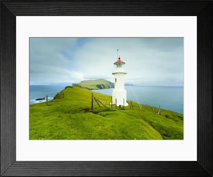 Framed Print : Stunning coastal scenery and the Mykinesholmur lighthouse, a footbridge connects this islet with the island of Mykines over a 35 metre deep gorge, Mykines Island, Faroe Islands Framed Print : Stunning coastal scenery and the Mykinesholmur lighthouse, a footbridge connects this islet with the island of Mykines over a 35 metre deep gorge, Mykines Island, Faroe Islands