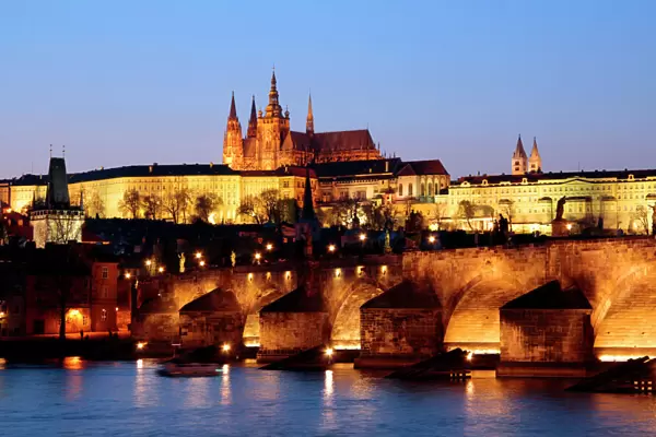 Prague Castle on the skyline and the Charles Bridge over the River Vltava