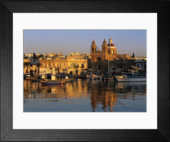 Framed Print : Harbour with Luzzu fishing boats and Marsaxlokk Parish Church at sunrise