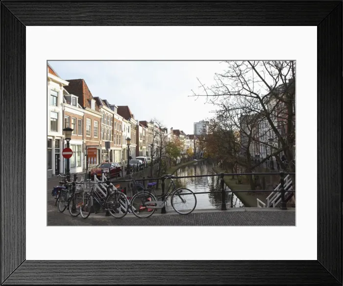 Framed Print : Looking along the Catharijnsingel, bicycles stand on a bridge over a canal in Utrecht Framed Print : Looking along the Catharijnsingel, bicycles stand on a bridge over a canal in Utrecht