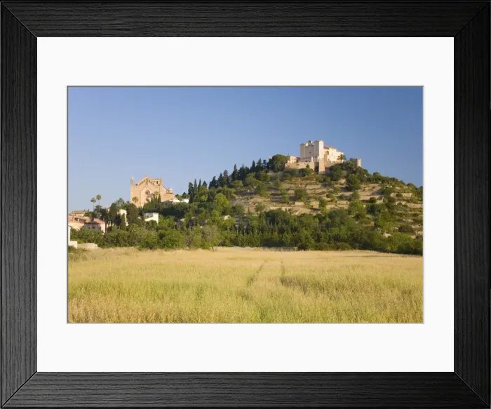 Framed Print : View across fields to the parish church and hilltop Sanctuary of Sant Salvador Framed Print : View across fields to the parish church and hilltop Sanctuary of Sant Salvador