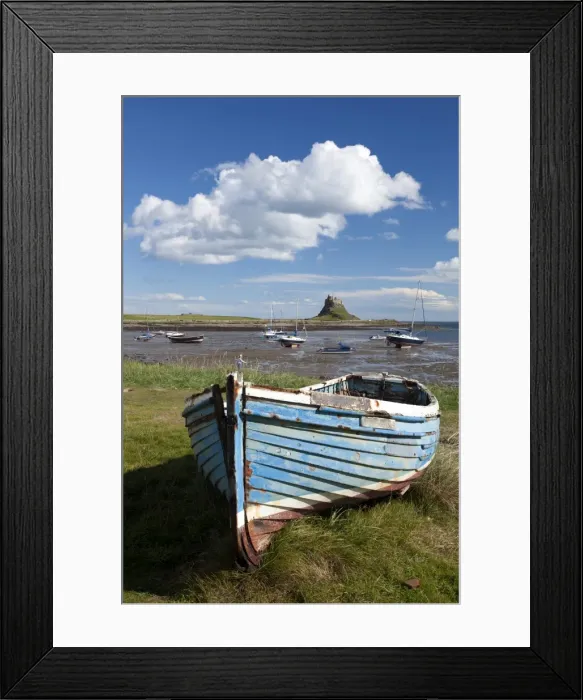 Framed Print : Old wooden fishing boat on a grassy bank with Lindisfarne harbour and Lindisfarne Castle in the background, Holy Island (Lindisfarne), Northumberland, England, United Framed Print : Old wooden fishing boat on a grassy bank with Lindisfarne harbour and Lindisfarne Castle in the background, Holy Island (Lindisfarne), Northumberland, England, United