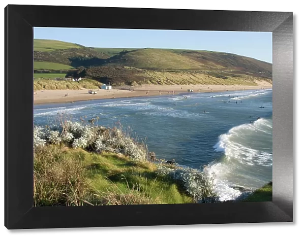 The beach with surfers at Woolacombe, Devon, England, United Kingdom, Europe
