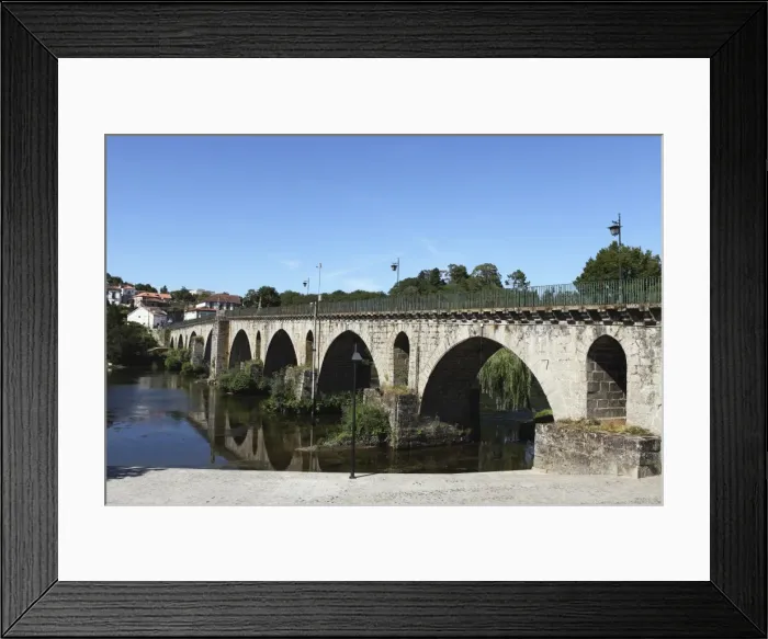 Framed Print : The medieval arched stone bridge across the River Lima at the town of Ponte da Barca Framed Print : The medieval arched stone bridge across the River Lima at the town of Ponte da Barca