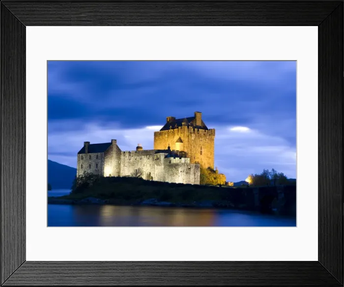 Framed Print : Eilean Donan Castle floodlit against deep blue twilight sky and water of Loch Duich Framed Print : Eilean Donan Castle floodlit against deep blue twilight sky and water of Loch Duich
