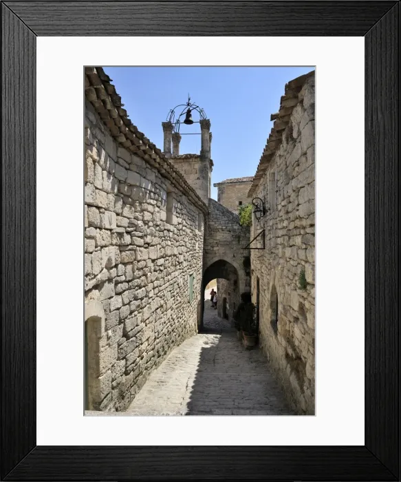 Framed Print : Cobbled alley and bell tower in the picturesque medieval village of Lacoste Framed Print : Cobbled alley and bell tower in the picturesque medieval village of Lacoste