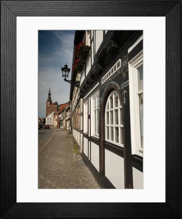 Framed Print : Historical Gothic style burgher houses along Kirchstrasse Street and Church of St Framed Print : Historical Gothic style burgher houses along Kirchstrasse Street and Church of St