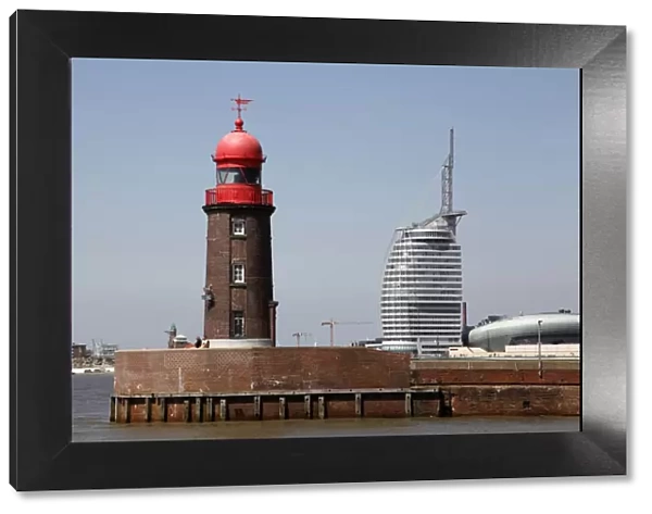 Lighthouse at old harbour, and Atlantic Hotel Sail City, Bremerhaven, Bremen