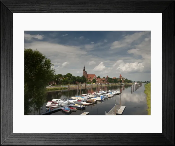 Framed Print : Boat harbour on the Elbe River below walls of historical town of Tangermunde Framed Print : Boat harbour on the Elbe River below walls of historical town of Tangermunde