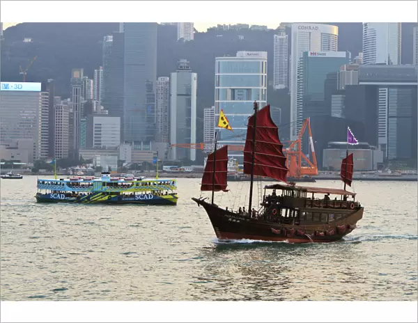 Star ferry and Chinese junk boat on Victoria Harbour, Hong Kong, China, Asia
