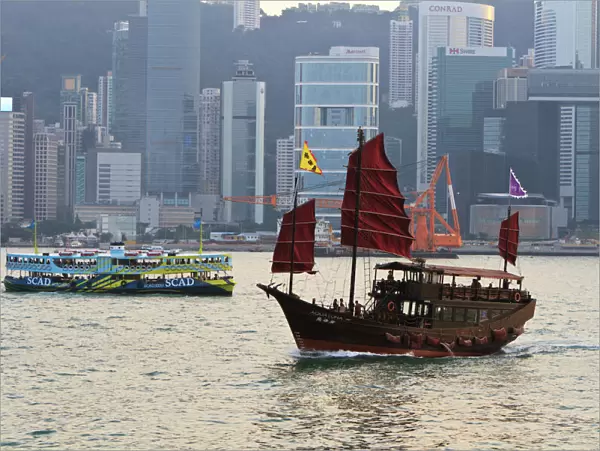 Star ferry and Chinese junk boat on Victoria Harbour, Hong Kong, China, Asia