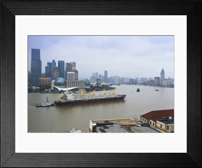 Framed Print : Large transport ship and tug on the Huangpu River that runs through Shanghai, China, Asia Framed Print : Large transport ship and tug on the Huangpu River that runs through Shanghai, China, Asia