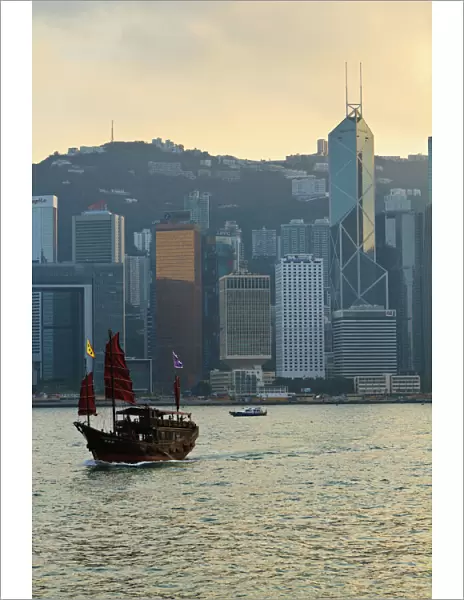 Chinese sailing junk on Victoria Harbour, the skyline of Central, Hong Kong Island beyond, Hong Kong, China, Asia