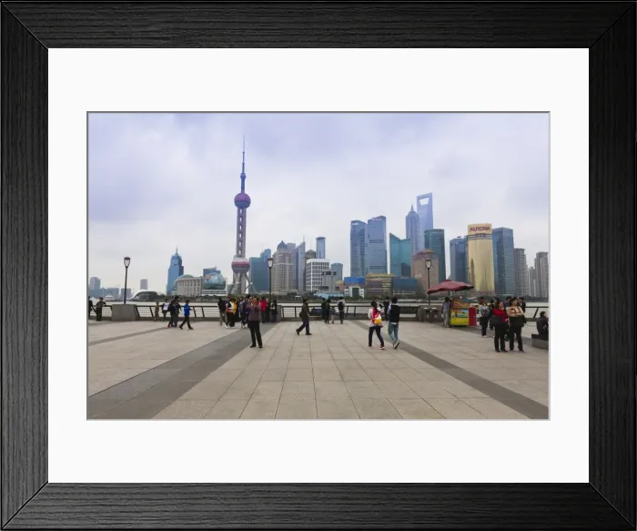 Framed Print : Pedestrians and tourists on the Bund, the futuristic skyline of Pudong across the Huangpu River beyond, Shanghai, China, Asia Framed Print : Pedestrians and tourists on the Bund, the futuristic skyline of Pudong across the Huangpu River beyond, Shanghai, China, Asia