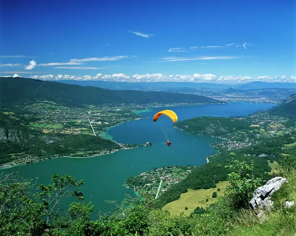 View over lake with paraglider, Lake Annecy, Rhone Alpes, France, Europe