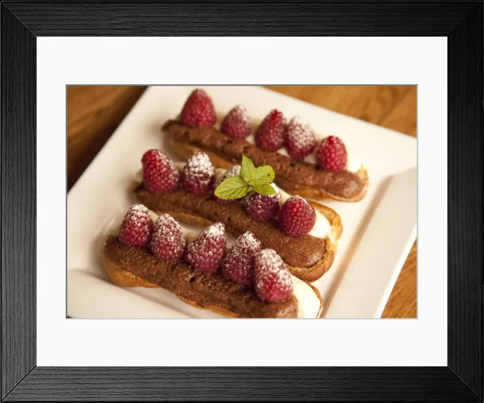 Framed Print : Chocolate eclairs topped with raspberries, French cafe, France, Europe Framed Print : Chocolate eclairs topped with raspberries, French cafe, France, Europe