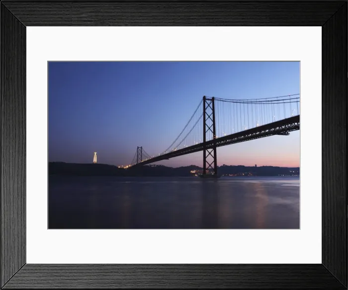 Framed Print : The 25 April Suspension Bridge at dusk over the River Tagus (Rio Tejo), Christus Rei is illuminated at Almada, Lisbon, Portugal, Europe