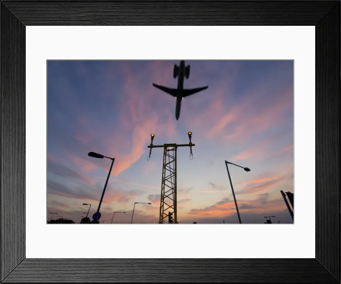 Framed Print : DC9 aircraft approaching over runway landing light gantries at sunset, London, England, United Kingdom, Europe Framed Print : DC9 aircraft approaching over runway landing light gantries at sunset, London, England, United Kingdom, Europe