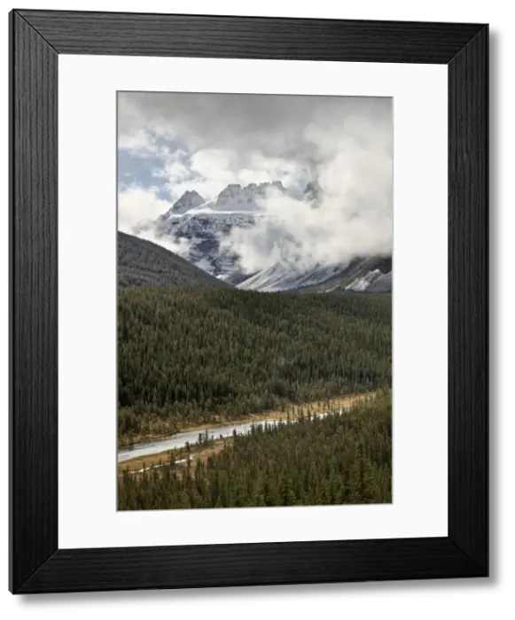 Framed Print : Snow-covered mountains among the clouds above an evergreen forest, Banff National Park, UNESCO World Heritage Site, Alberta, Canada, North America Framed Print : Snow-covered mountains among the clouds above an evergreen forest, Banff National Park, UNESCO World Heritage Site, Alberta, Canada, North America