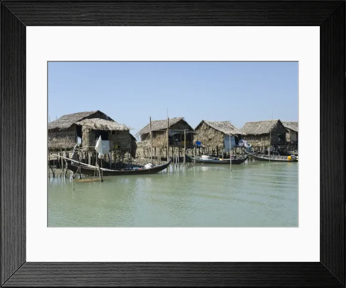 Framed Print : Bamboo huts and boats along a waterway, Irrawaddy delta, Myanmar (Burma), Asia