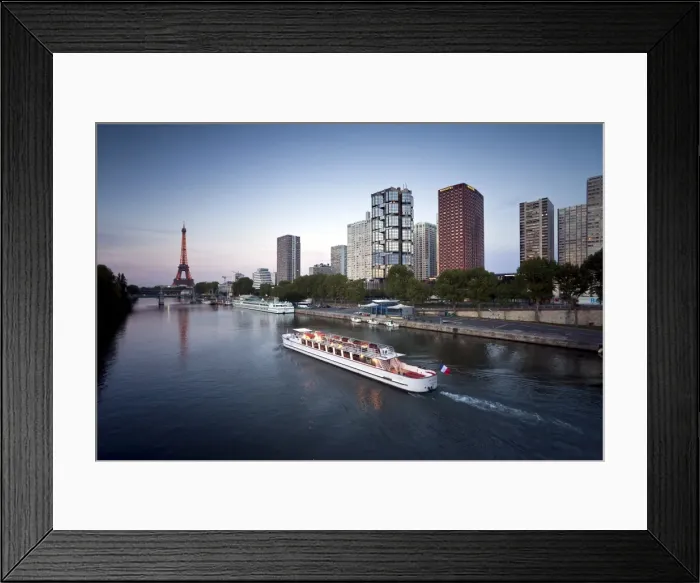 Framed Print : Night view of River Seine with high-rise buildings on the Left Bank and Eiffel Tower in the distance, Paris, France, Europe