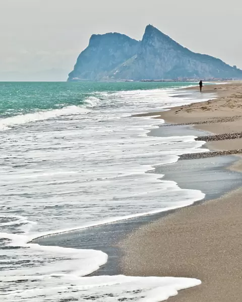 Tourist walking toward Gibraltar, Alcaidesa beach, near Sotogrande, Andalucia, Spain, Europe