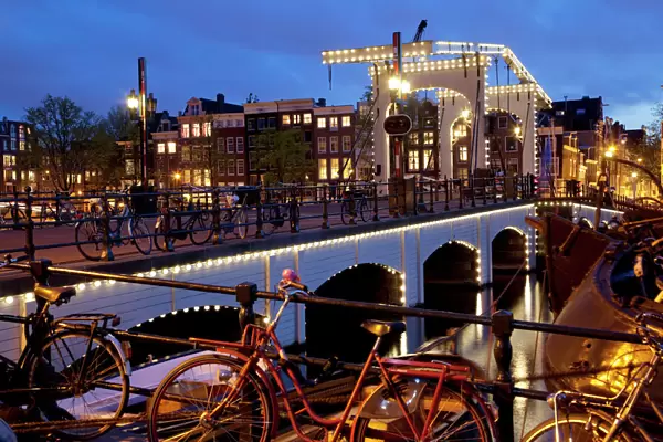 Magere Brug (Skinny Bridge) at dusk, Amsterdam, Holland, Europe