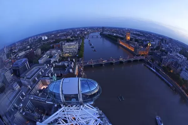 View of passenger pod capsule, Houses of Parliament, Big Ben and the River Thames from the London Eye at dusk, London, England, United Kingdom, Europe