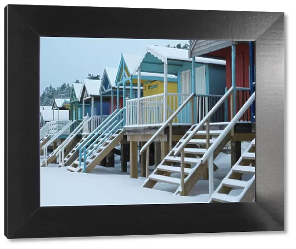 Beach huts in the snow at Wells next the Sea, Norfolk, England