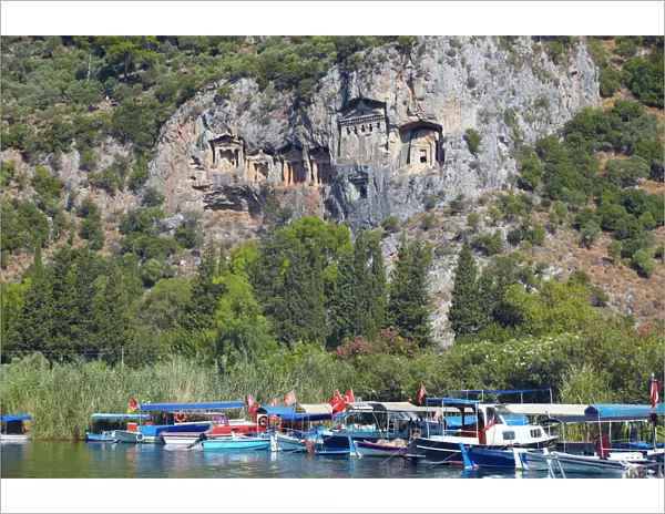 Lycian tombs of Dalyan with fishing and tourists boats below, Dalyan, Anatolia, Turkey, Asia Minor, Eurasia