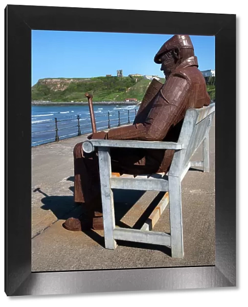 Ray Lonsdale sculpture of a Man on a Bench in North Bay, Scarborough, North Yorkshire, Yorkshire, England, United Kingdom, Europe
