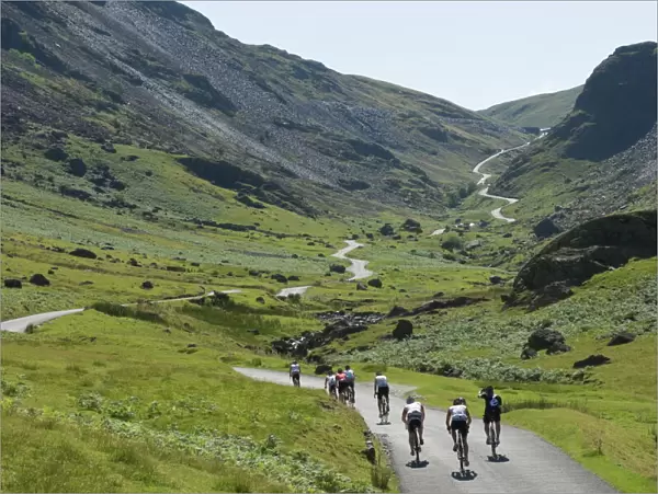Cyclists ascending Honister Pass, Lake District National Park, Cumbria, England, United Kingdom, Europe