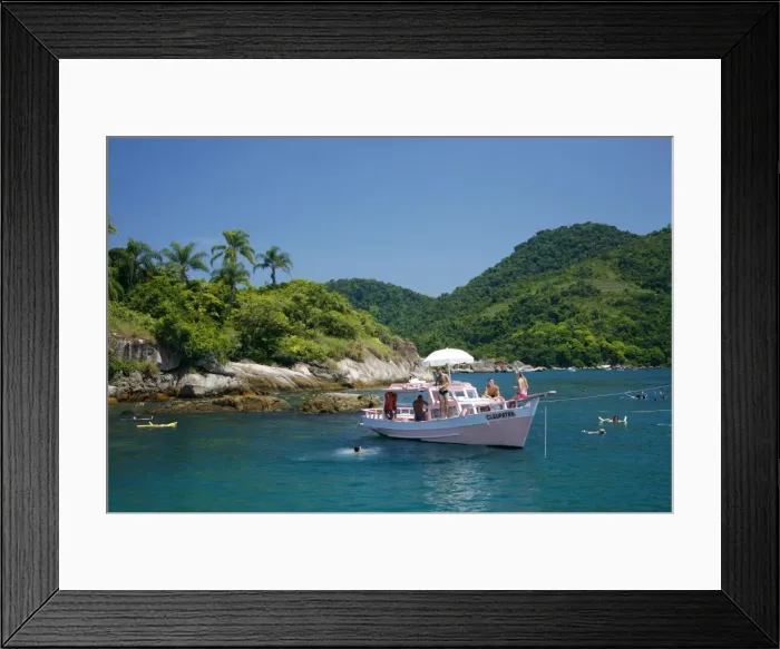 Framed Print : Tourist on a chartered fishing boat cruising between the different beaches and islands around Parati, Rio de Janeiro State, Brazil, South America Framed Print : Tourist on a chartered fishing boat cruising between the different beaches and islands around Parati, Rio de Janeiro State, Brazil, South America