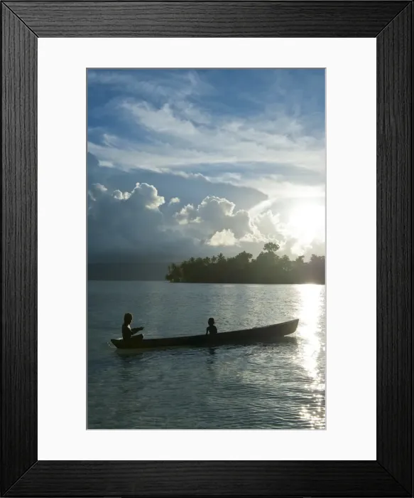 Framed Print : Boys in a canoe in backlit in the Marovo Lagoon, Solomon Islands, Pacific Framed Print : Boys in a canoe in backlit in the Marovo Lagoon, Solomon Islands, Pacific