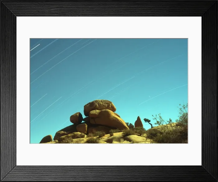 Framed Print : Time exposure of stars streaking across the sky with rock formations in the foreground, Joshua Tree National Park, California, United States of America, North America Framed Print : Time exposure of stars streaking across the sky with rock formations in the foreground, Joshua Tree National Park, California, United States of America, North America