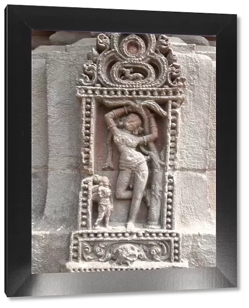 Erotic carving of woman on the 11th century Rajarani temple, known as the love temple, dedicated to Lord Shiva, Bhubaneshwar, Orissa, India, Asia