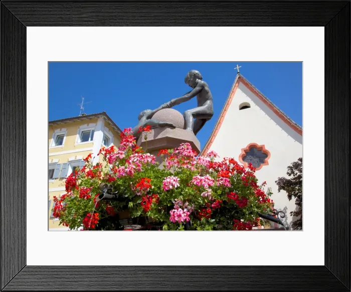 Framed Print : Statues and geraniums in Town Square, Ortisei, Gardena Valley, Bolzano Province, Trentino-Alto Adige / South Tyrol, Italian Dolomites, Italy, Europe Framed Print : Statues and geraniums in Town Square, Ortisei, Gardena Valley, Bolzano Province, Trentino-Alto Adige / South Tyrol, Italian Dolomites, Italy, Europe