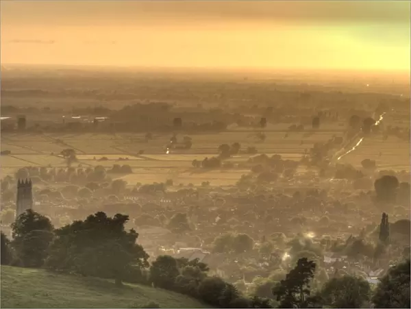 View of Glastonbury during sunset from Glastonbury Tor, Somerset, England, United Kingdom, Europe