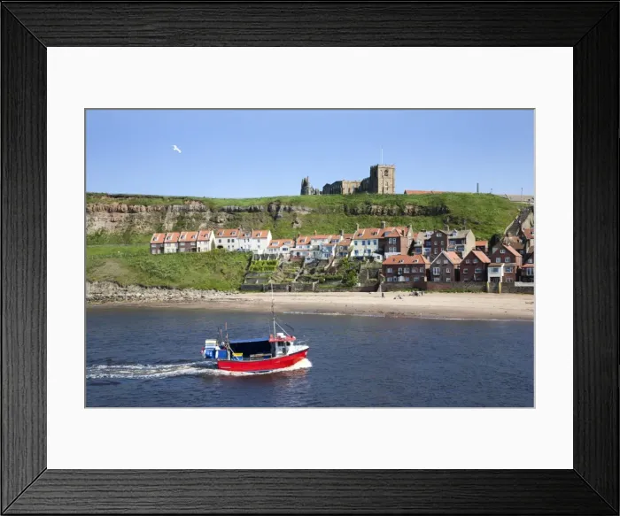 Framed Print : Fishing boat entering the harbour below Whitby Abbey, Whitby, North Yorkshire, Yorkshire, England, United Kingdom, Europe