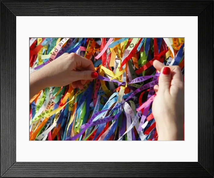 Framed Print : Woman tying lucky ribbon at Igreja Nosso Senhor do Bonfim church, Salvador (Salvador de Bahia), Bahia, Brazil, South America