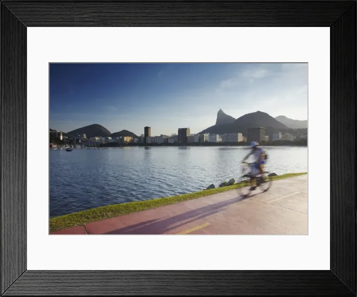 Framed Print : Cyclist on pathway around Botafogo Bay with Christ the Redeemer statue (Cristo Redentor) in the background, Rio de Janeiro, Brazil, South America Framed Print : Cyclist on pathway around Botafogo Bay with Christ the Redeemer statue (Cristo Redentor) in the background, Rio de Janeiro, Brazil, South America