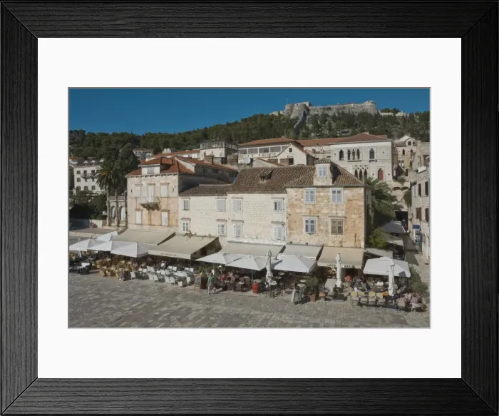 Framed Print : Pavement cafes in the main square overlooked by the ancient fortress, in the medieval city of Hvar, island of Hvar, Dalmatia, Croatia, Europe Framed Print : Pavement cafes in the main square overlooked by the ancient fortress, in the medieval city of Hvar, island of Hvar, Dalmatia, Croatia, Europe