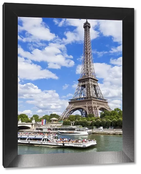 Bateaux Mouches tour boat on River Seine passing the Eiffel Tower, Paris, France, Europe
