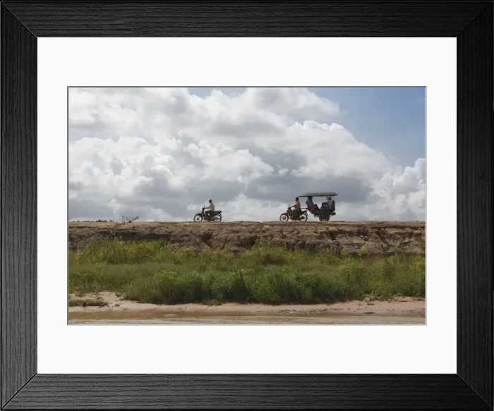 Framed Print : A motorbike being followed by a moto-rickshaw along the banks of the Tonle Sap Lake, Cambodia, Indochina, Southeast Asia, Asia Framed Print : A motorbike being followed by a moto-rickshaw along the banks of the Tonle Sap Lake, Cambodia, Indochina, Southeast Asia, Asia