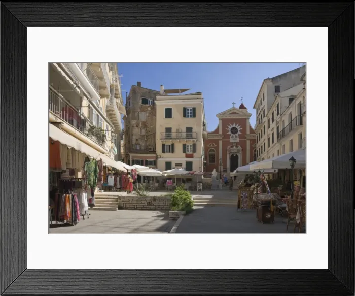 Framed Print : A sunny square with a church, pavement cafes, and small shops, in old Corfu. Island of Corfu, Ionian Islands, Greek Islands, Greece, Europe Framed Print : A sunny square with a church, pavement cafes, and small shops, in old Corfu. Island of Corfu, Ionian Islands, Greek Islands, Greece, Europe
