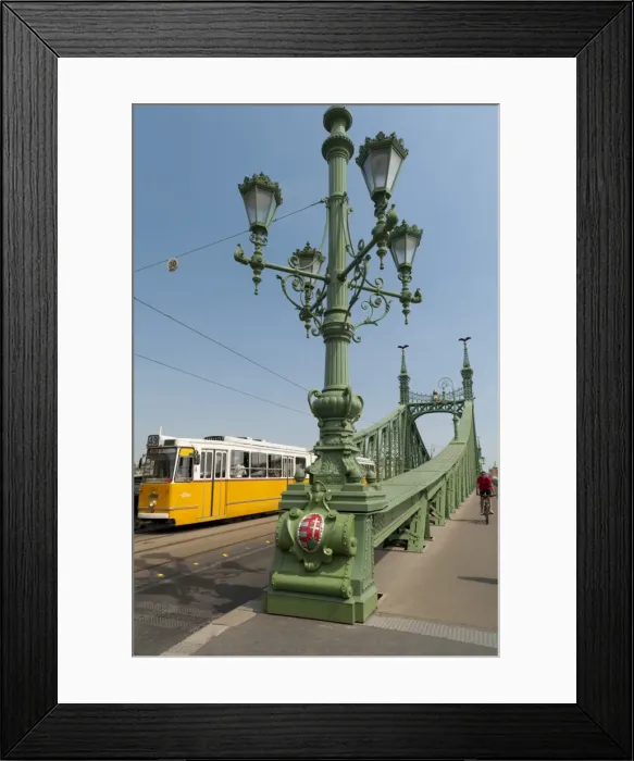 Framed Print : Tram and cyclist on Independence Bridge spanning Danube River, Budapest, Hungary, Europe Framed Print : Tram and cyclist on Independence Bridge spanning Danube River, Budapest, Hungary, Europe