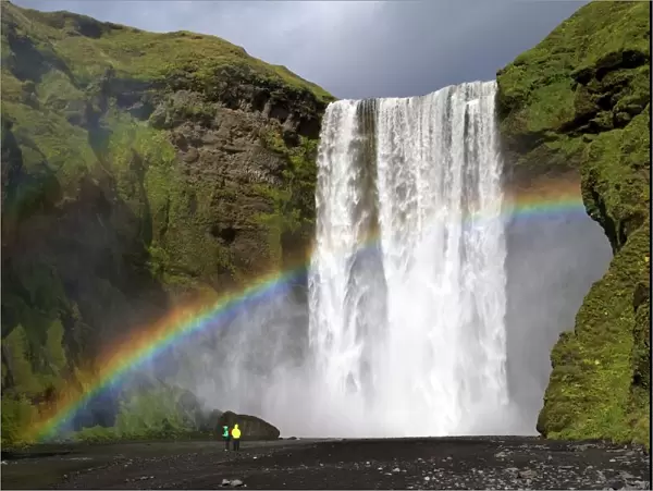 Skogafoss waterfall with rainbow in summer sunshine, South coast, Iceland, Polar Regions